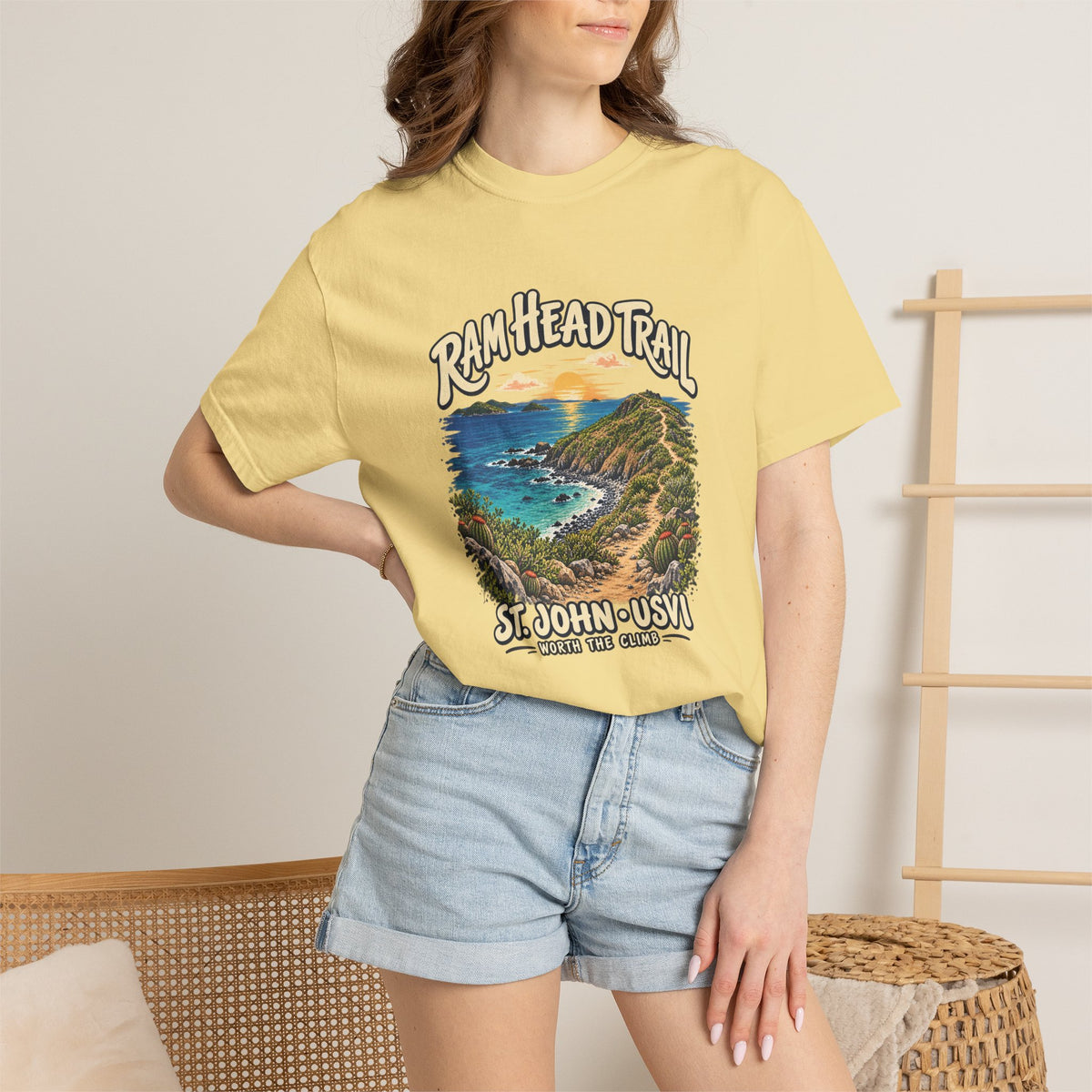 Model wearing a Comfort Colors 1717 T-shirt with the Ram Head Trail coastal illustration and St. John USVI lettering on the front.