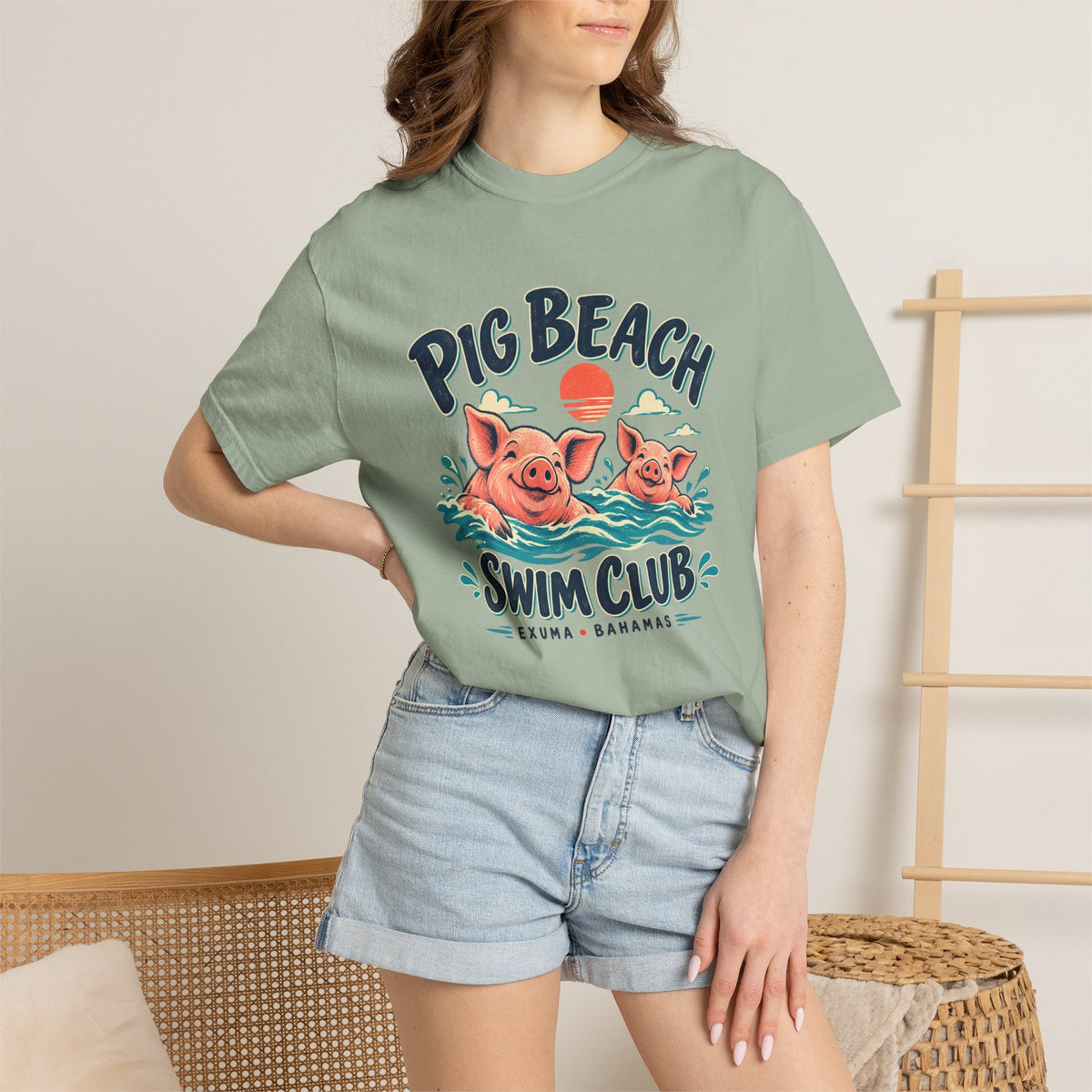 Model wearing the Pig Beach Swim Club Exuma Bahamas Comfort Colors 1717 T-shirt.