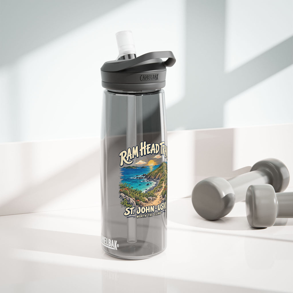 Charcoal CamelBak Eddy 25 oz bottle with Ram Head Trail St John USVI artwork in a lifestyle setting.