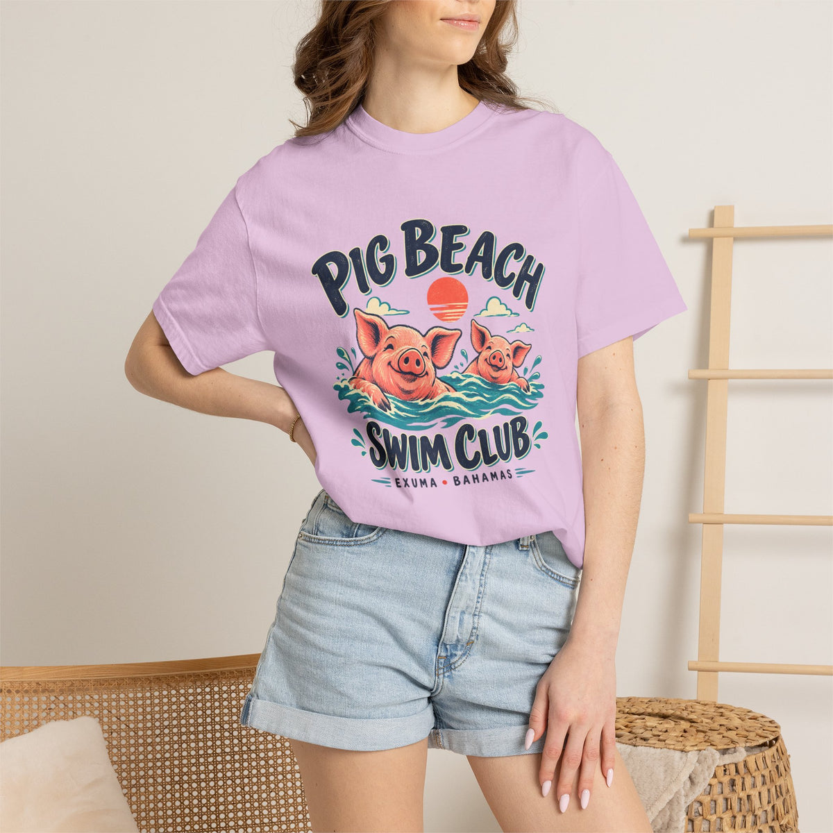 Model wearing the Pig Beach Swim Club Exuma Bahamas Comfort Colors 1717 T-shirt.