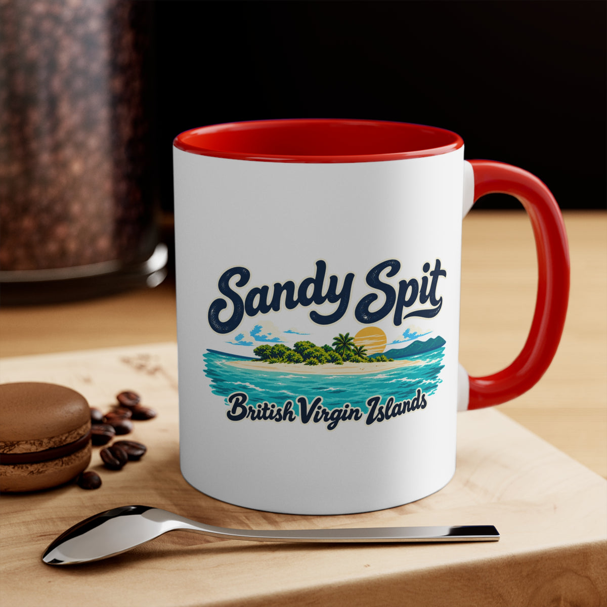 Sandy Spit BVI accent coffee mug displayed on a tabletop with coffee beans and a spoon.