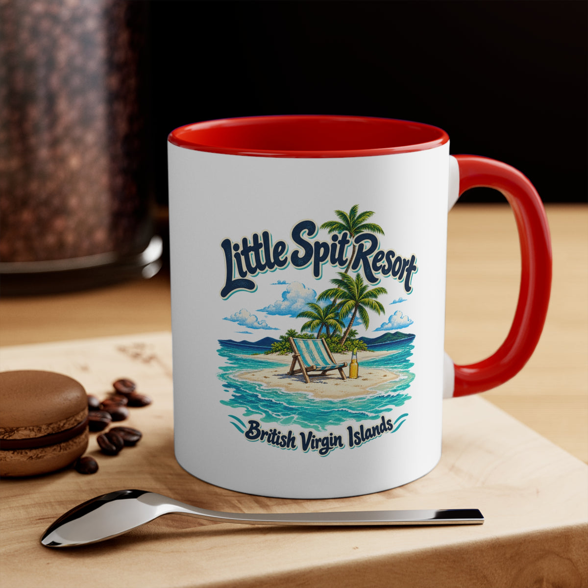 Little Spit Resort BVI accent coffee mug displayed on a tabletop with coffee beans and a spoon.