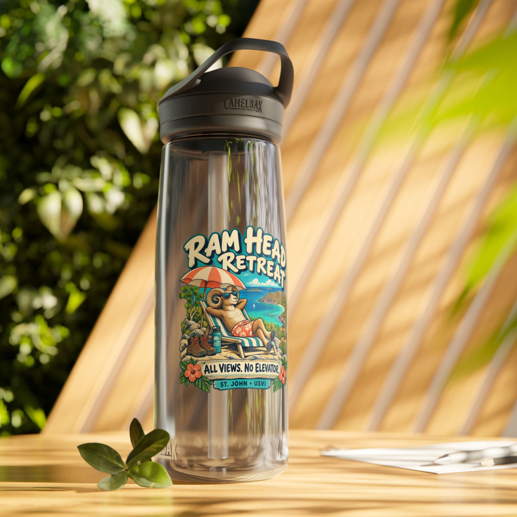 Charcoal CamelBak Eddy 25 oz water bottle with Ram Head Retreat St John USVI artwork in a lifestyle setting.