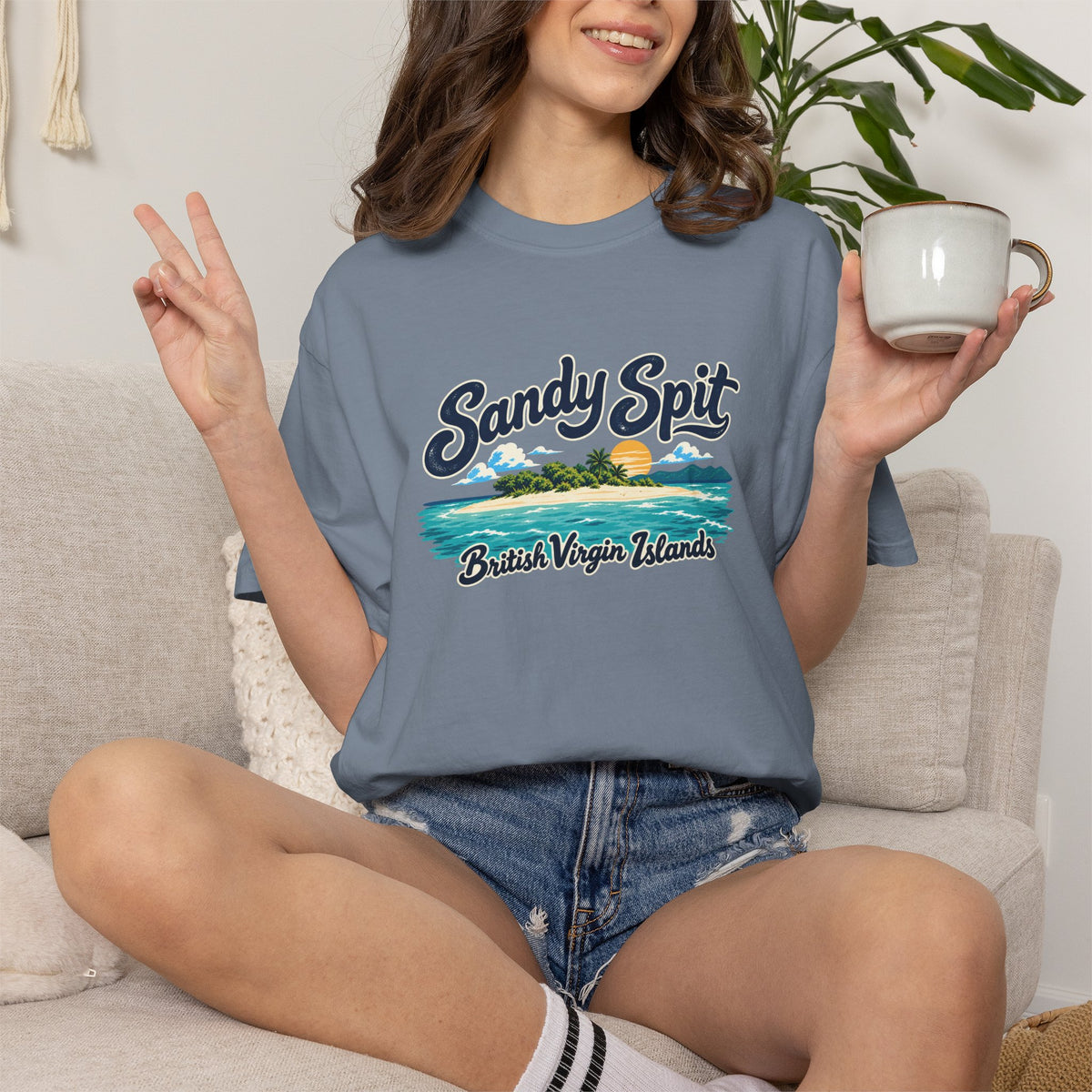 Model wearing the Sandy Spit BVI Comfort Colors 1717 T-shirt with colorful palm-tree island artwork and British Virgin Islands lettering.