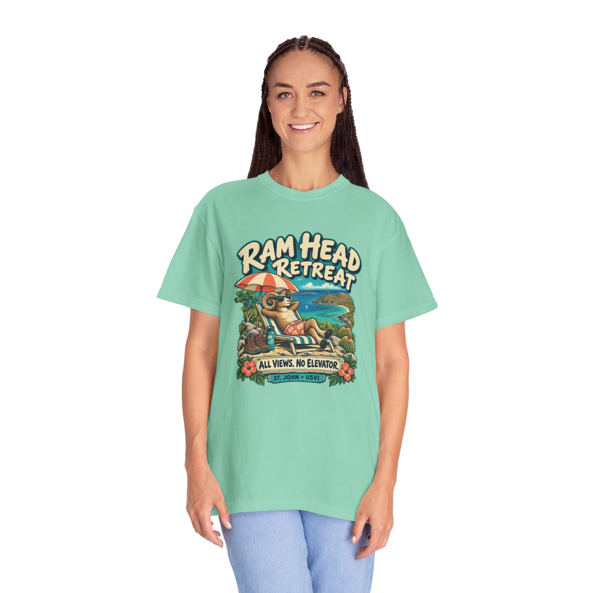Model wearing a Comfort Colors 1717 T-shirt with the Ram Head Retreat lounging ram illustration and St. John USVI lettering.