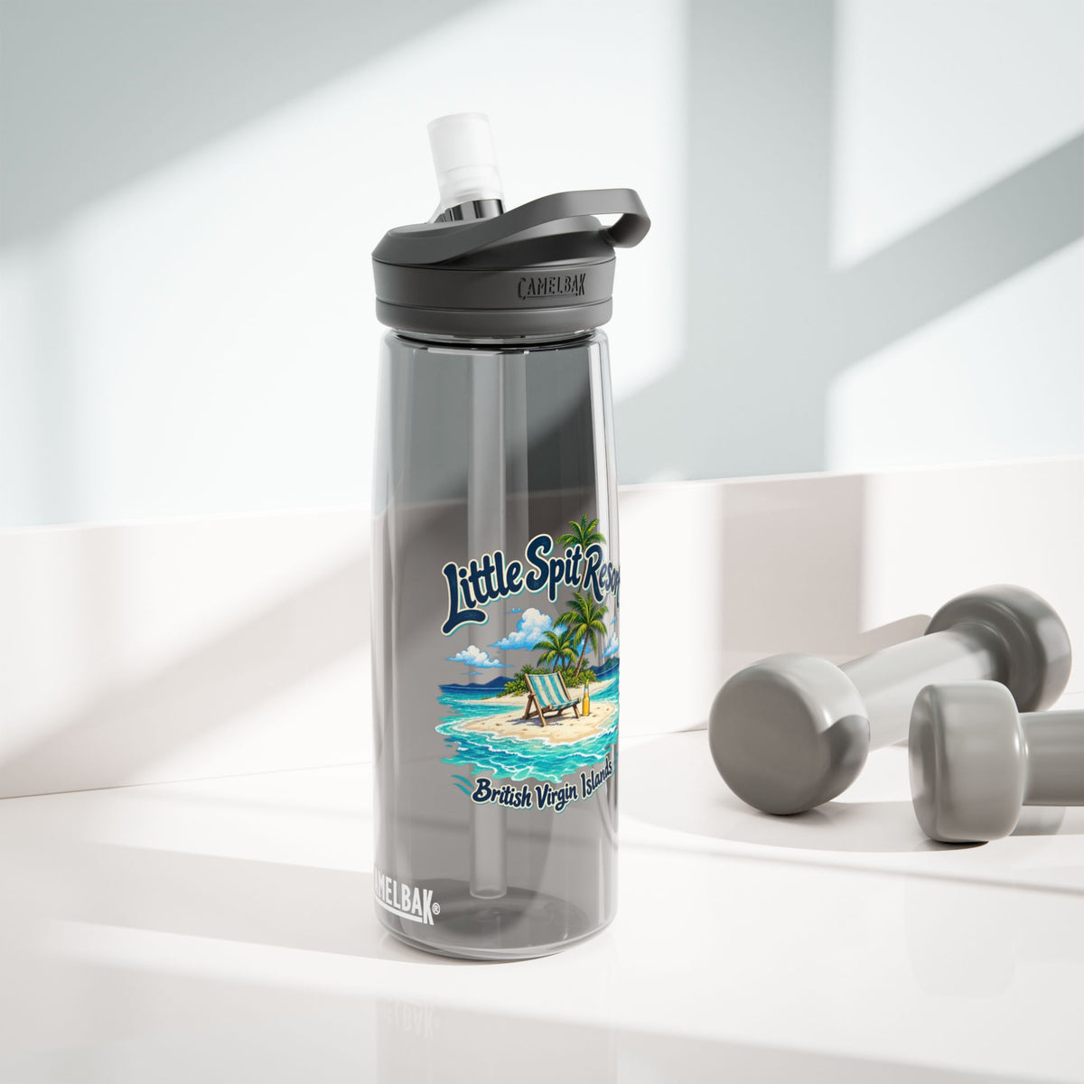 Little Spit Resort BVI tropical artwork on a charcoal CamelBak Eddy 25-ounce water bottle in a lifestyle product mockup.