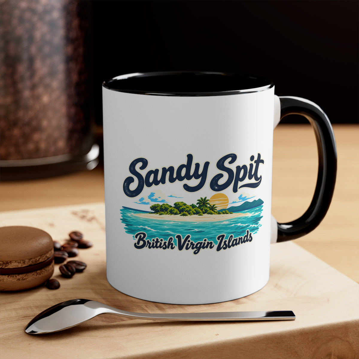 Sandy Spit BVI accent coffee mug displayed on a tabletop with coffee beans and a spoon.
