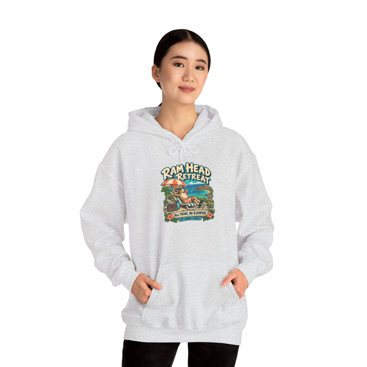 Model wearing a Ram Head Retreat St John USVI Gildan 18500 hoodie with lounging ram artwork.