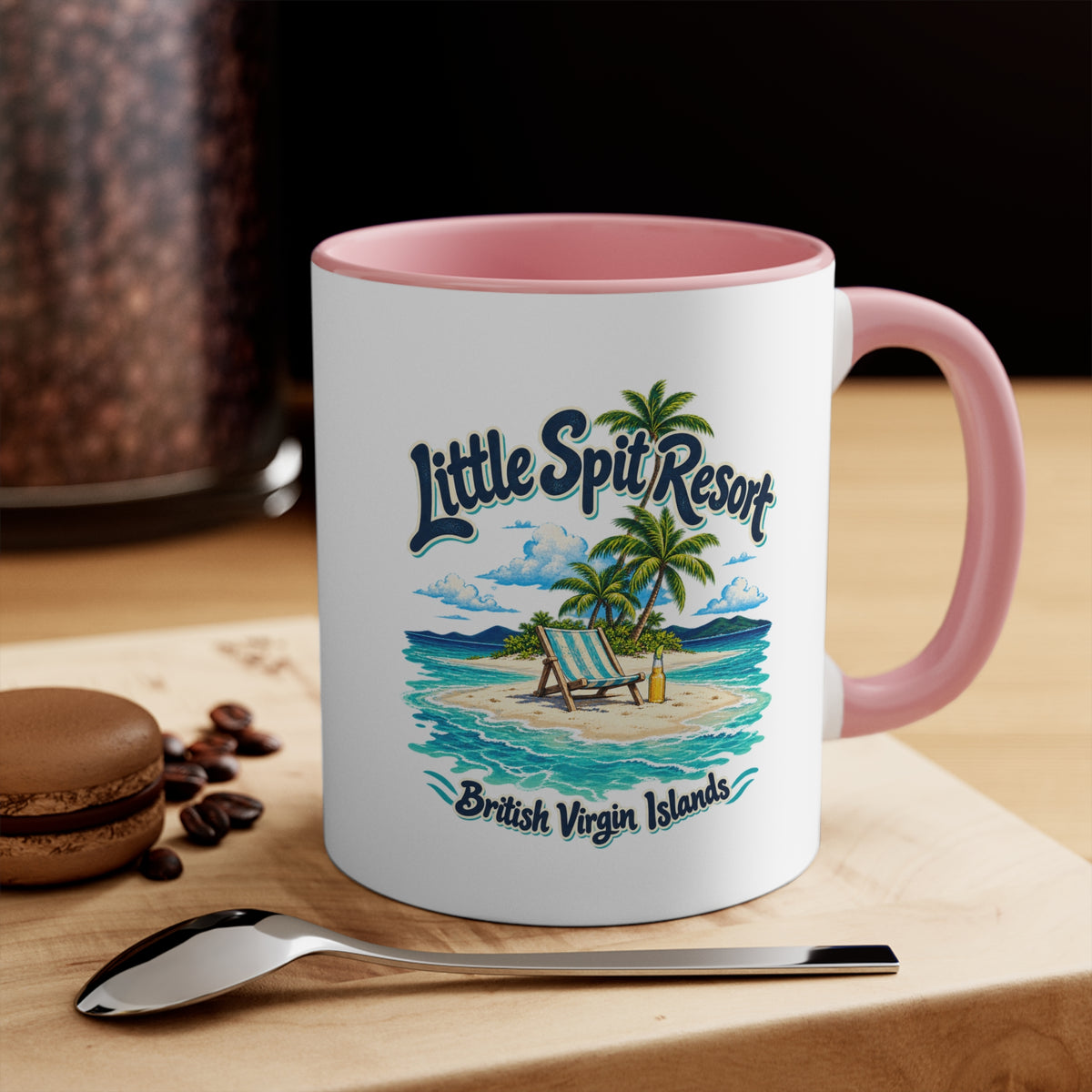 Little Spit Resort BVI accent coffee mug displayed on a tabletop with coffee beans and a spoon.