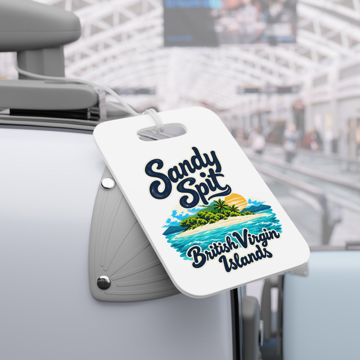 Sandy Spit British Virgin Islands double-sided luggage tag shown in a travel-setting product mockup.