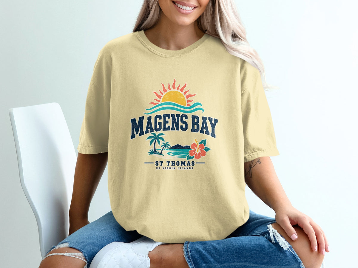 Yellow t-shirt with "Magens Bay St Thomas US Virgin Islands" graphic and tropical scene.
