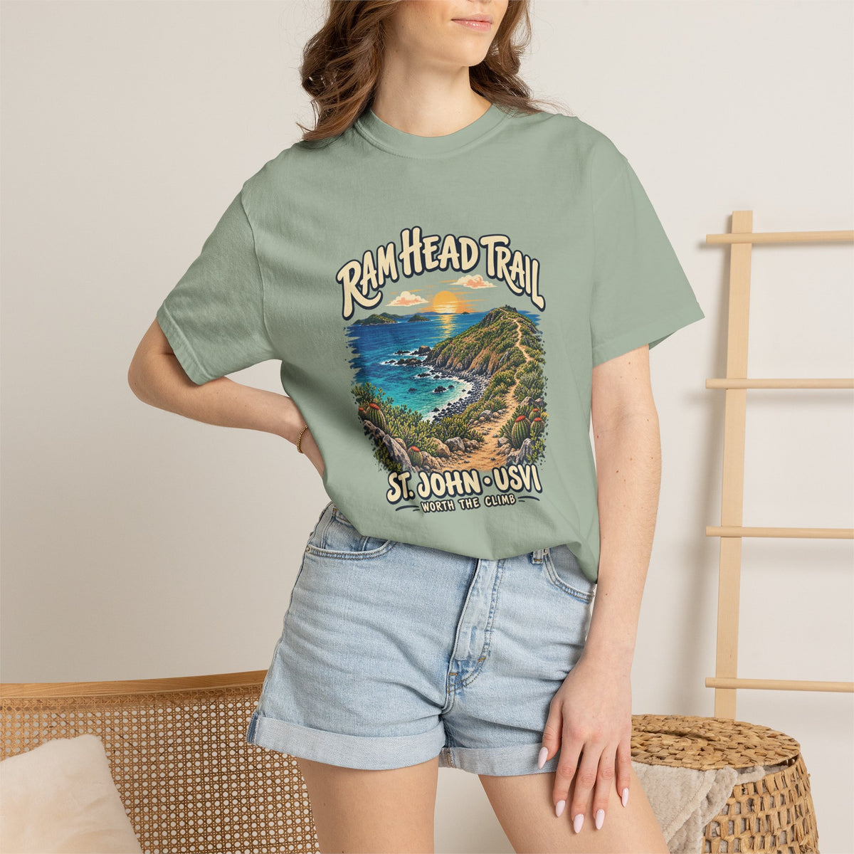 Model wearing a Comfort Colors 1717 T-shirt with the Ram Head Trail coastal illustration and St. John USVI lettering on the front.