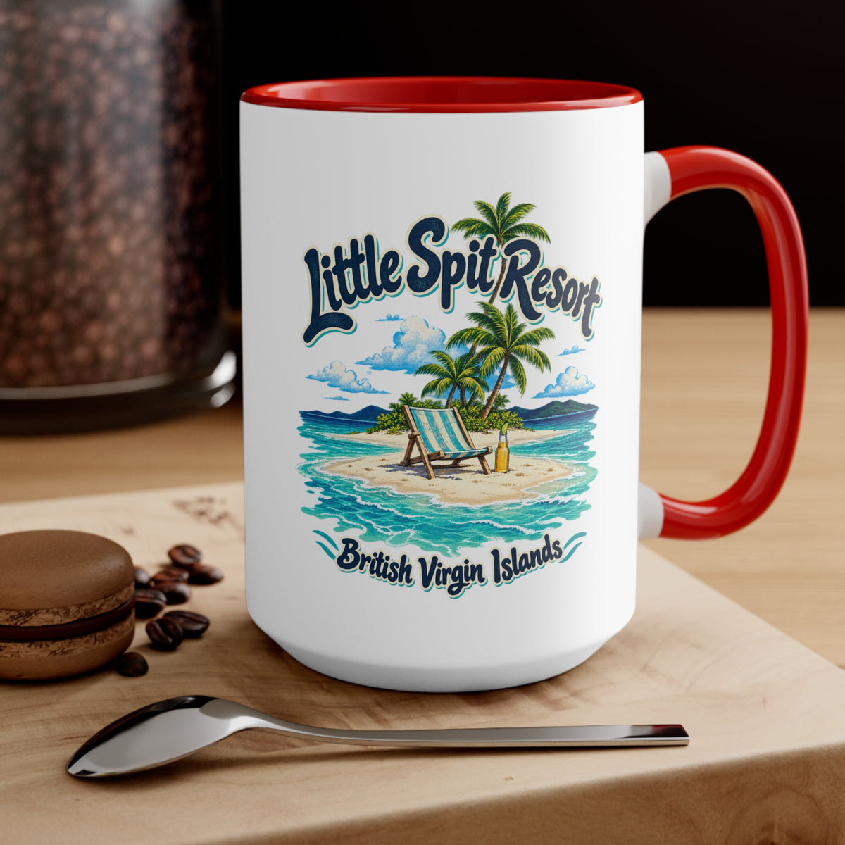 Little Spit Resort BVI accent coffee mug displayed on a tabletop with coffee beans and a spoon.