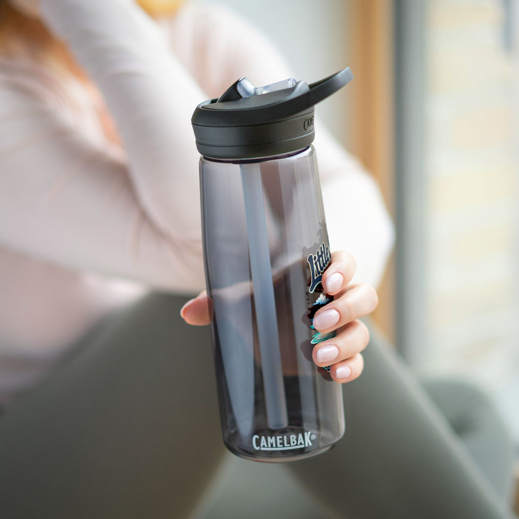Little Spit Resort BVI tropical artwork on a charcoal CamelBak Eddy 25-ounce water bottle in a lifestyle product mockup.