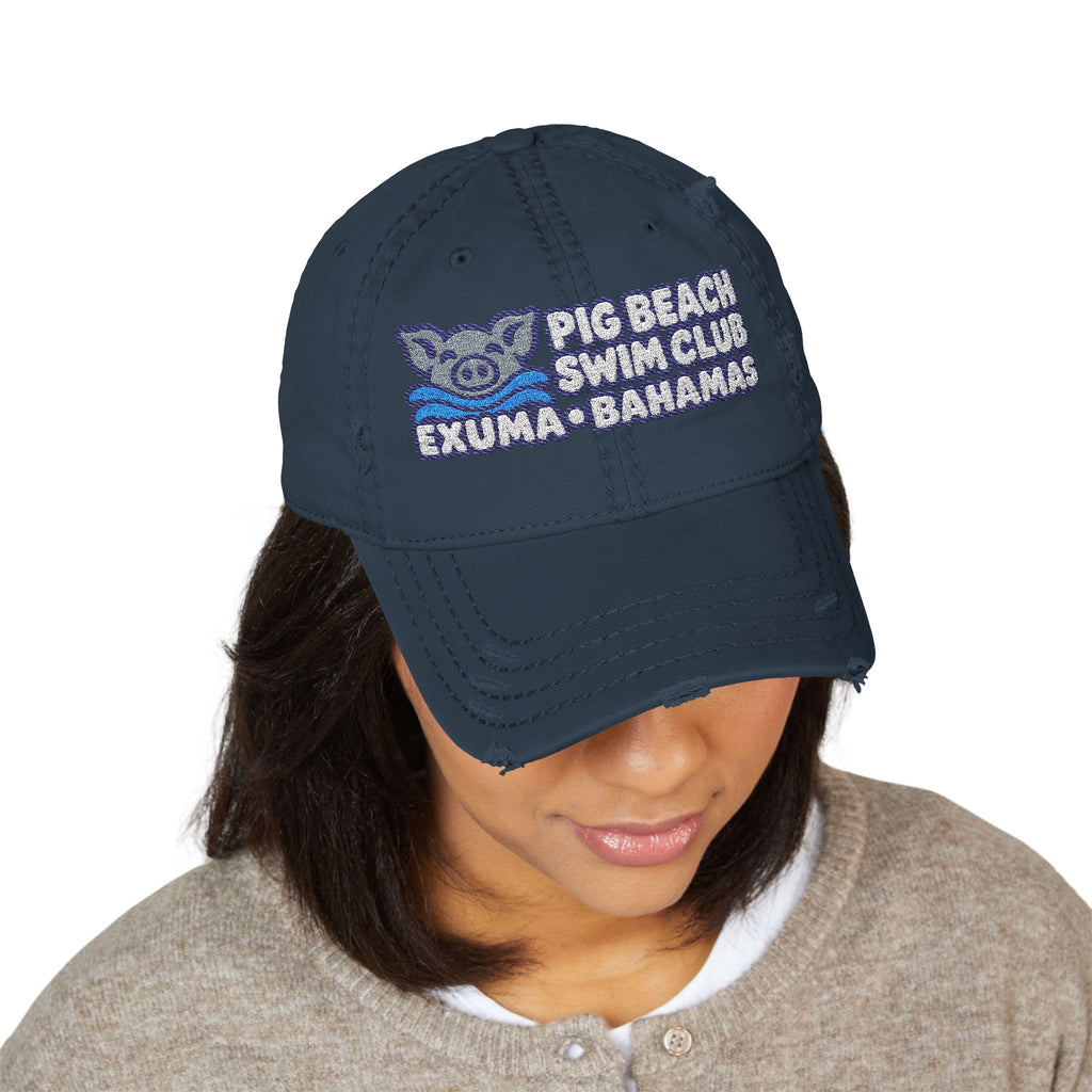 Model wearing the Dark Navy Pig Beach Swim Club embroidered dad hat with Exuma Bahamas lettering