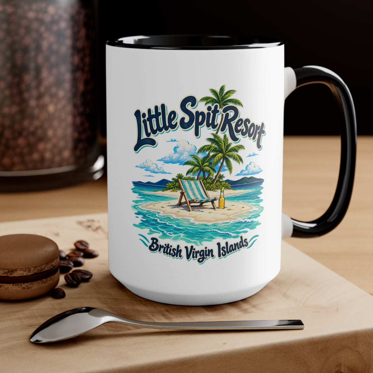 Little Spit Resort BVI accent coffee mug displayed on a tabletop with coffee beans and a spoon.