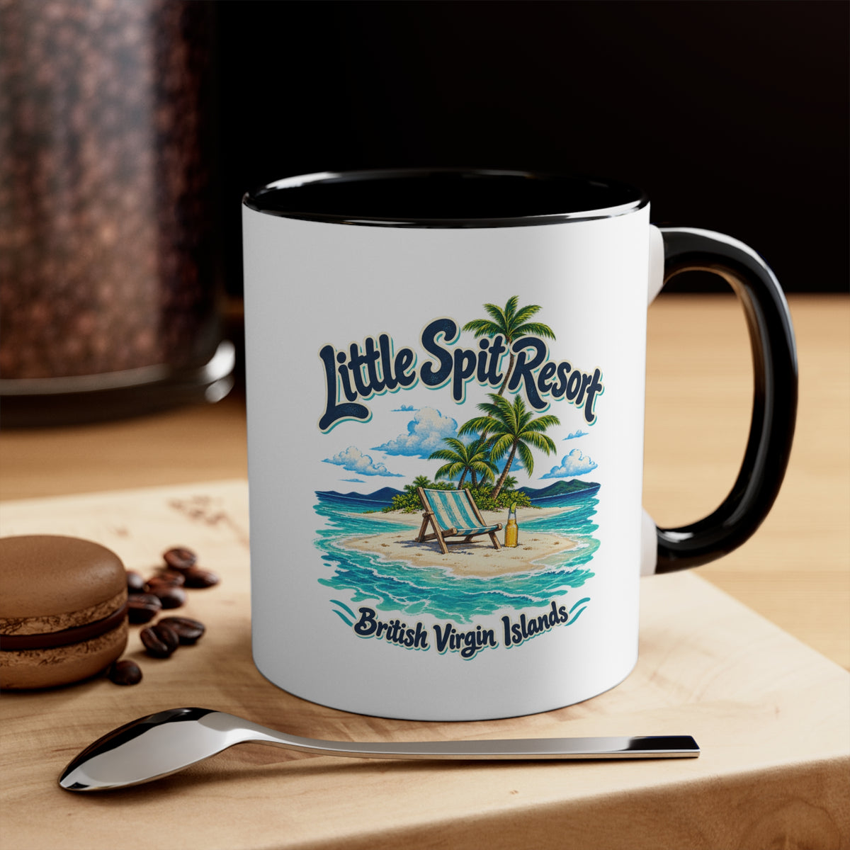 Little Spit Resort BVI accent coffee mug displayed on a tabletop with coffee beans and a spoon.