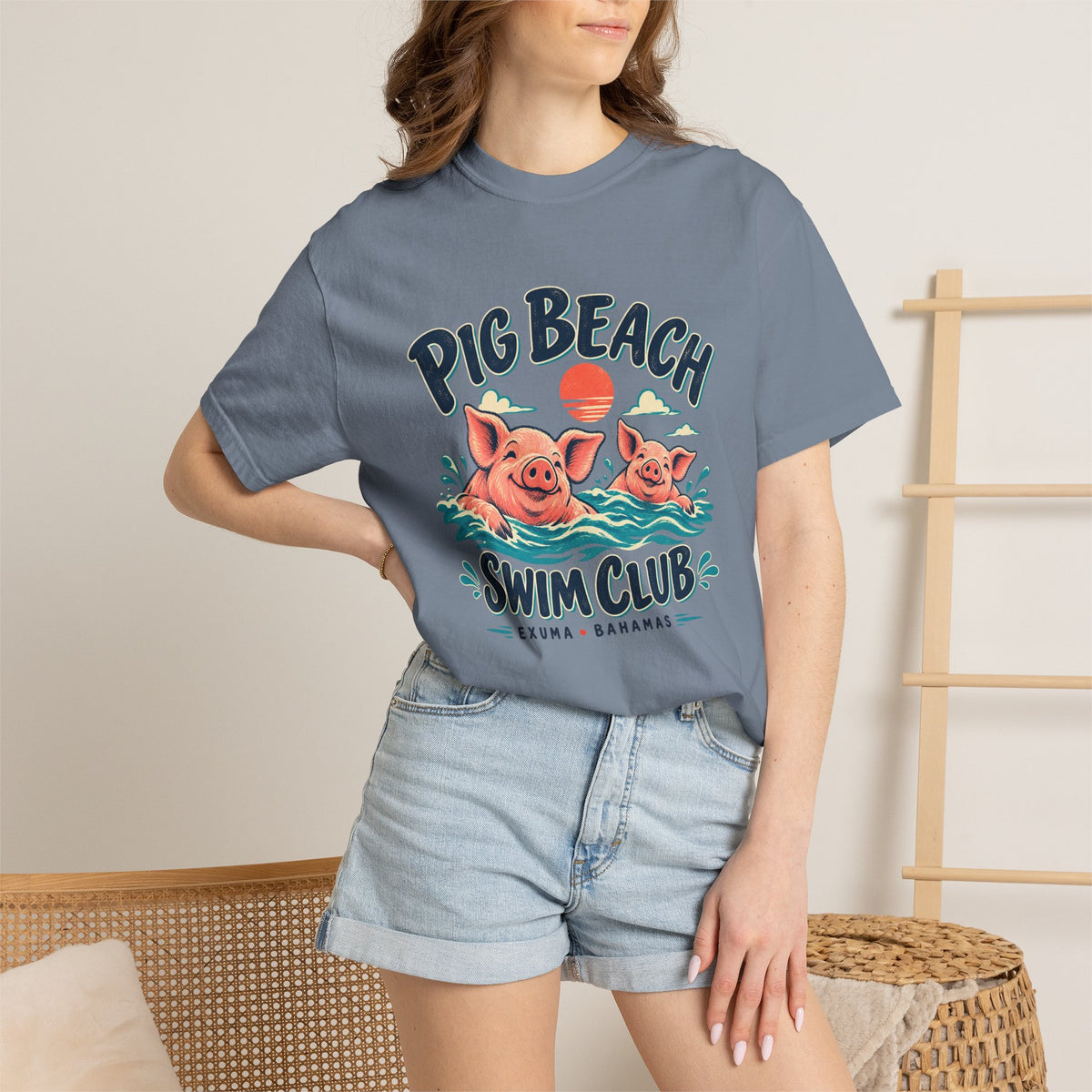 Model wearing the Pig Beach Swim Club Exuma Bahamas Comfort Colors 1717 T-shirt.