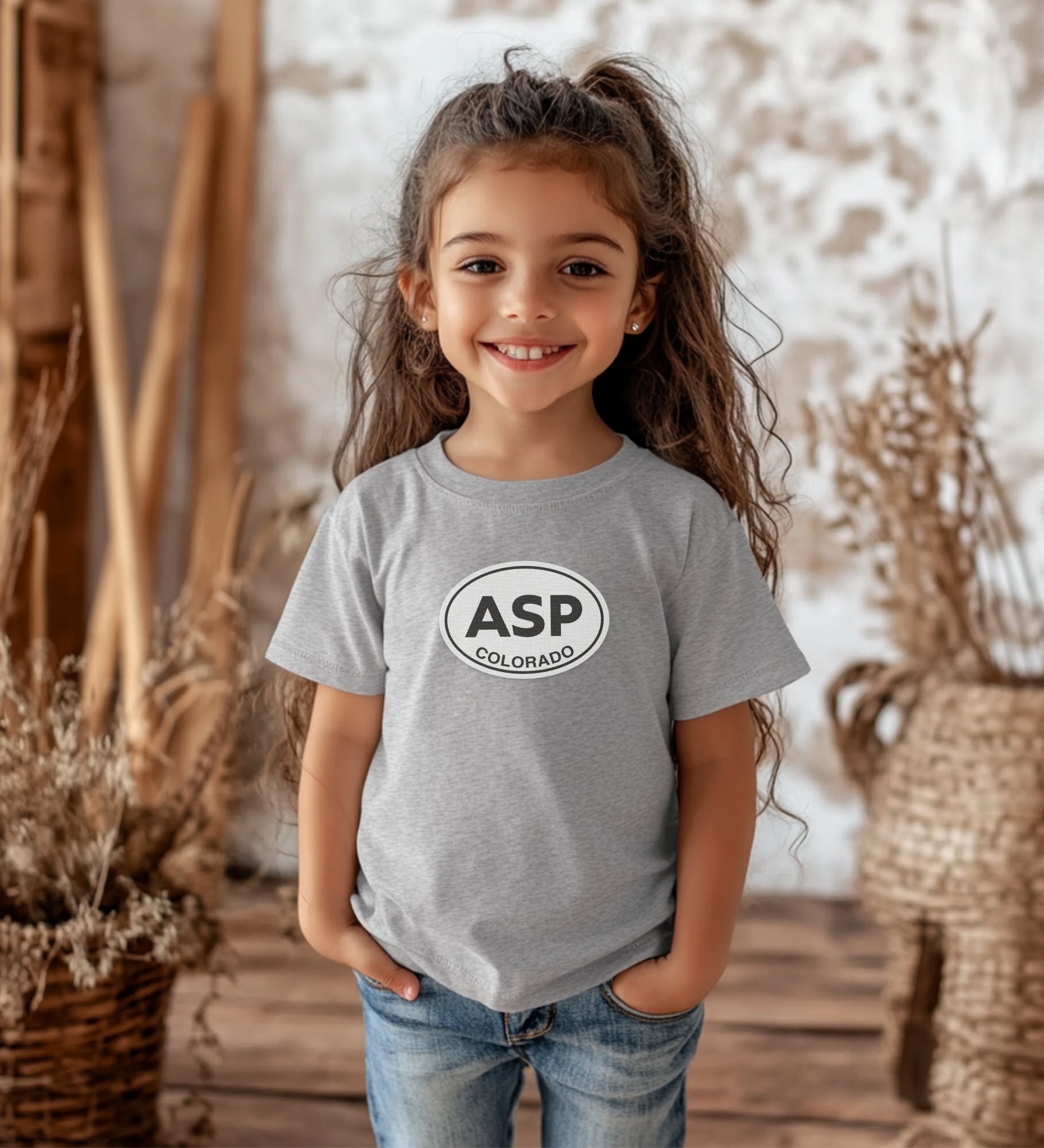 Aspen building snowmen in Wagner Park youth clothing and travel souvenirs