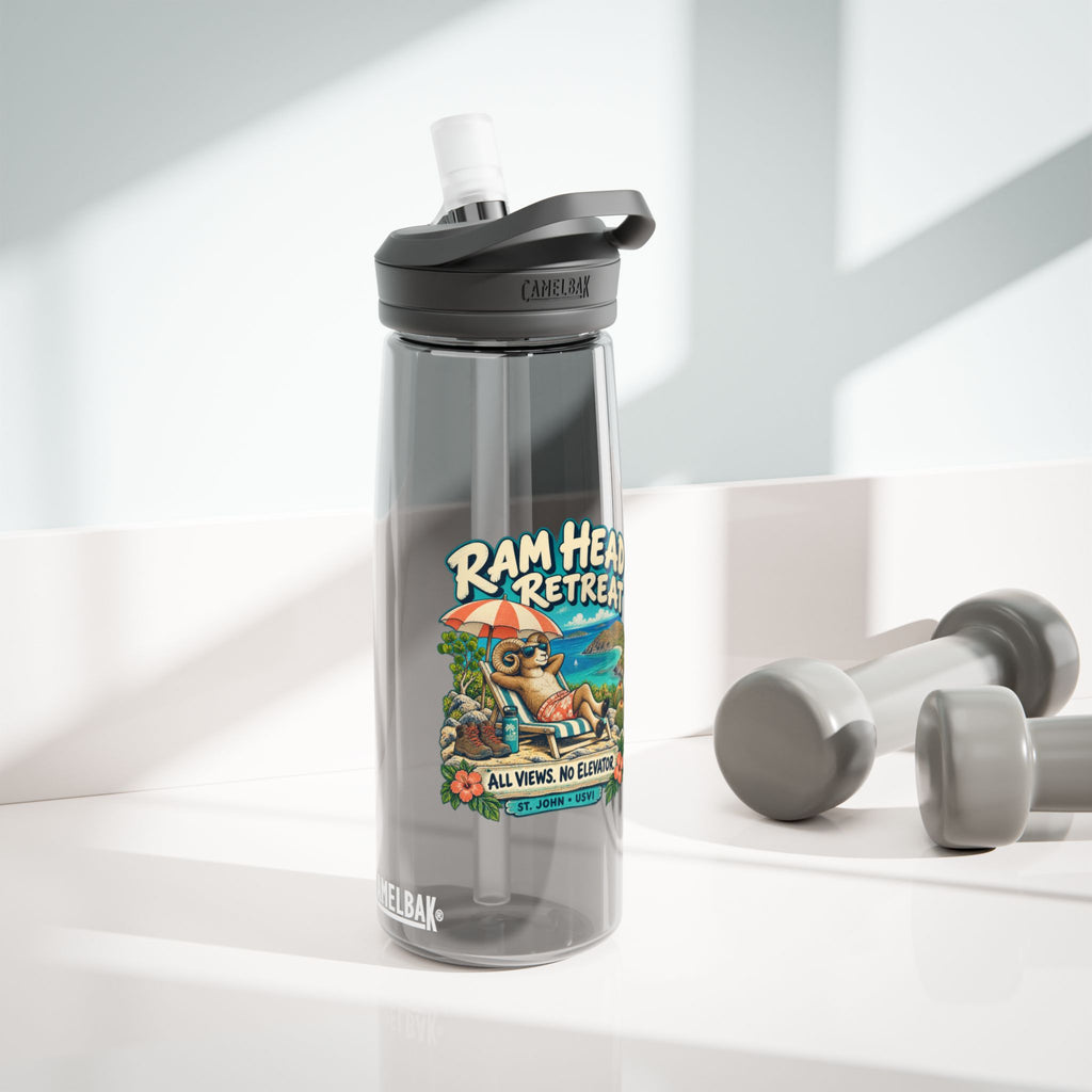 Charcoal CamelBak Eddy 25 oz water bottle with Ram Head Retreat St John USVI artwork in a lifestyle setting.