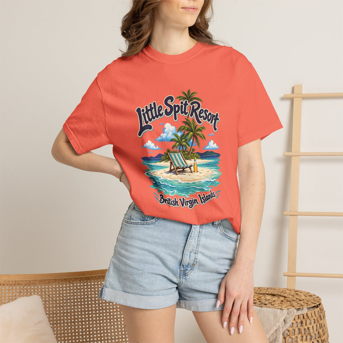 Model wearing the Little Spit Resort BVI Comfort Colors 1717 T-shirt with a playful beach-chair, palm-tree, and bottle illustration.