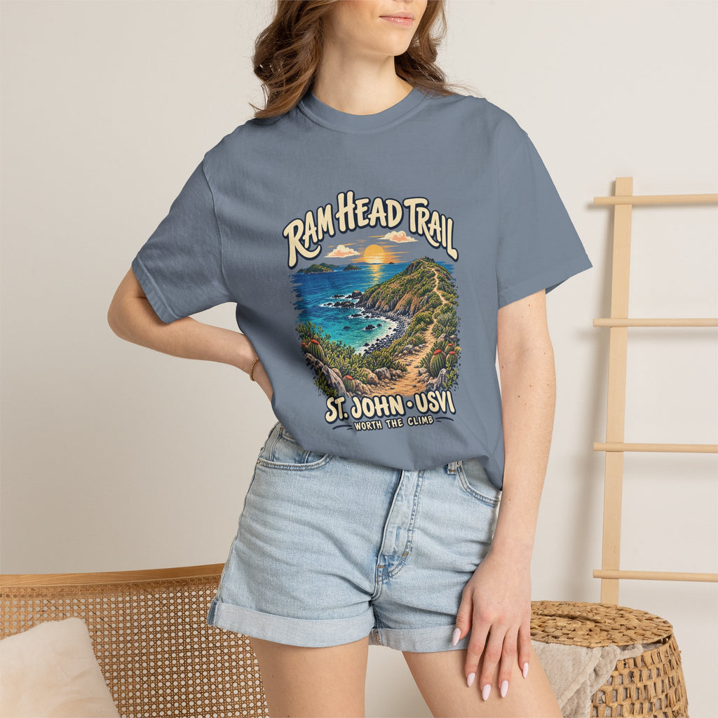 Model wearing a Blue Jean Comfort Colors 1717 T-shirt with Ram Head Trail coastal artwork, styled with denim shorts in an indoor setting.