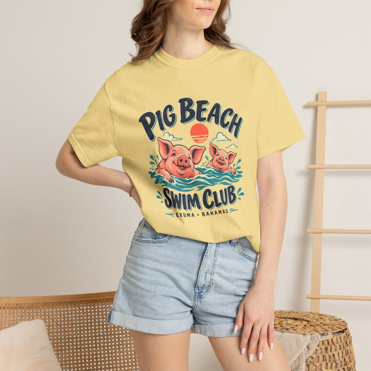 Model wearing the Pig Beach Swim Club Exuma Bahamas Comfort Colors 1717 T-shirt.