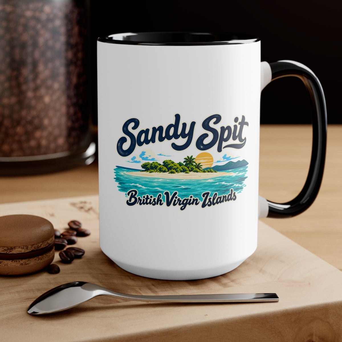 Sandy Spit BVI accent coffee mug displayed on a tabletop with coffee beans and a spoon.