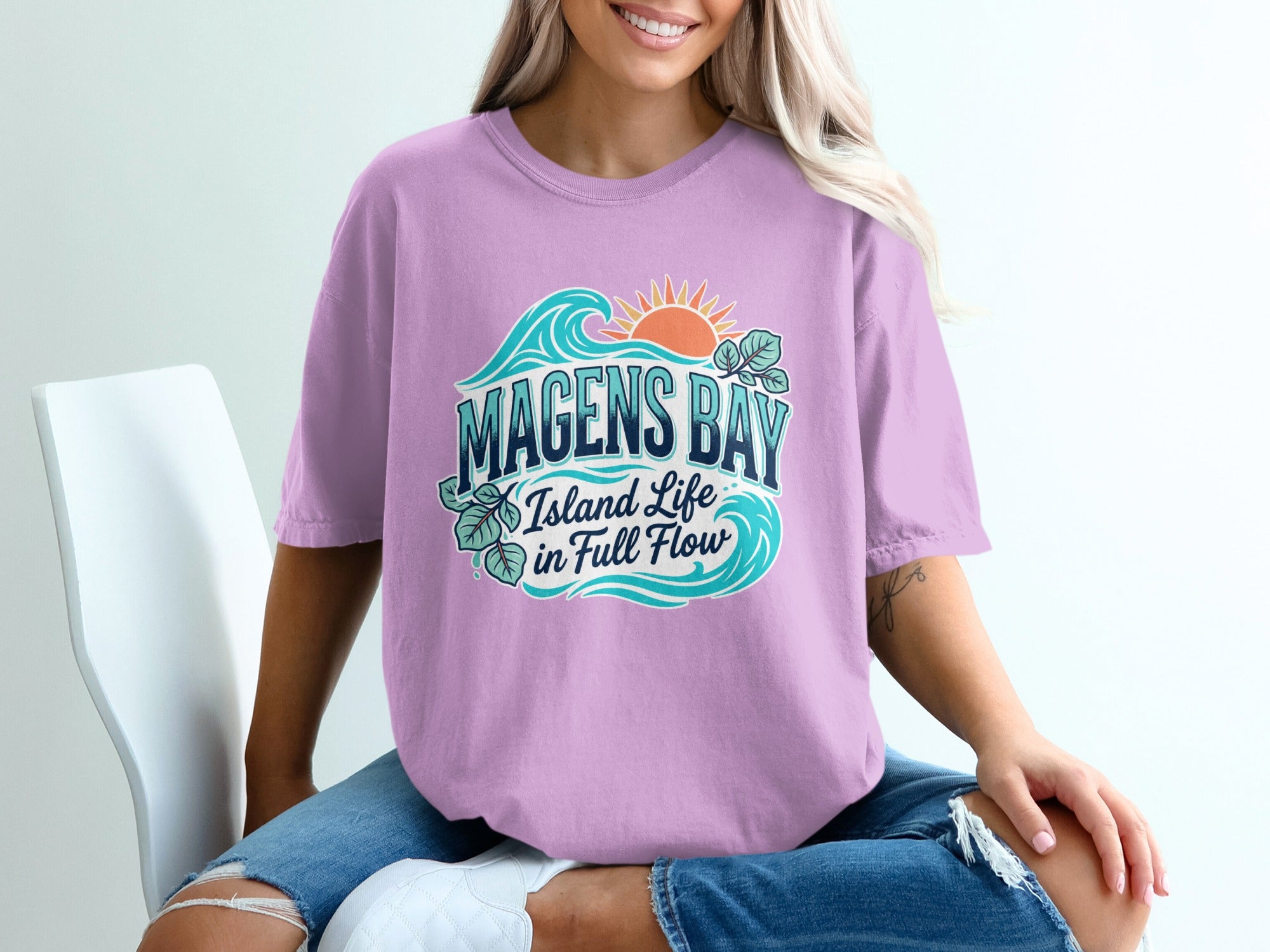 Purple t-shirt with Magens Bay island life in full flow graphic.