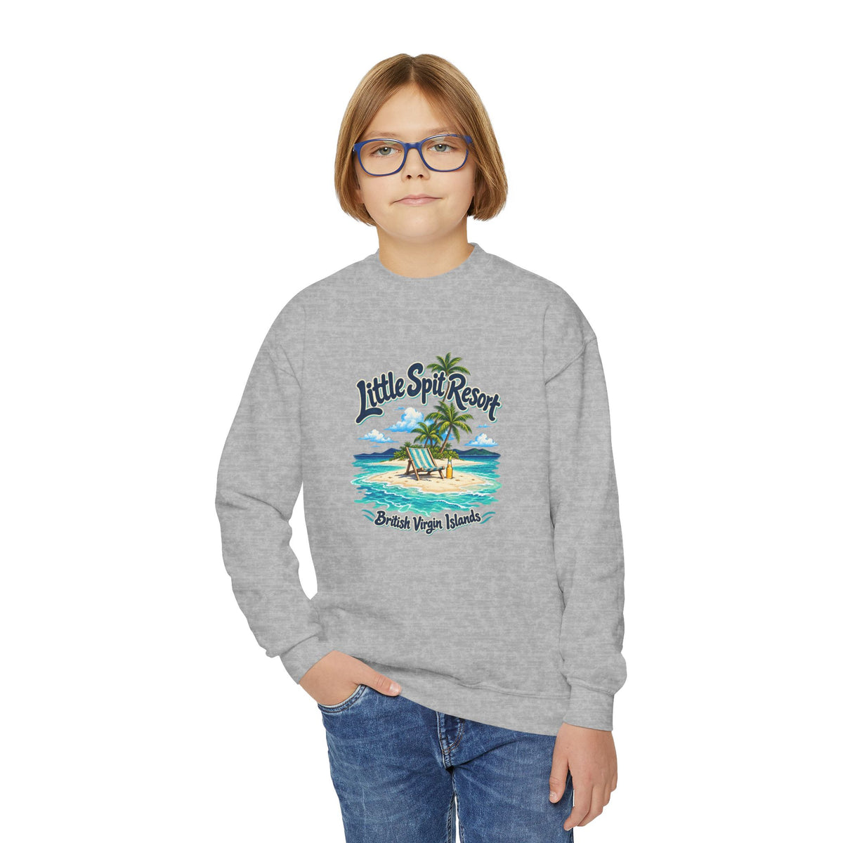 Youth model wearing the Little Spit Resort BVI Gildan 18000B sweatshirt with enlarged tropical artwork aligned high on the chest.