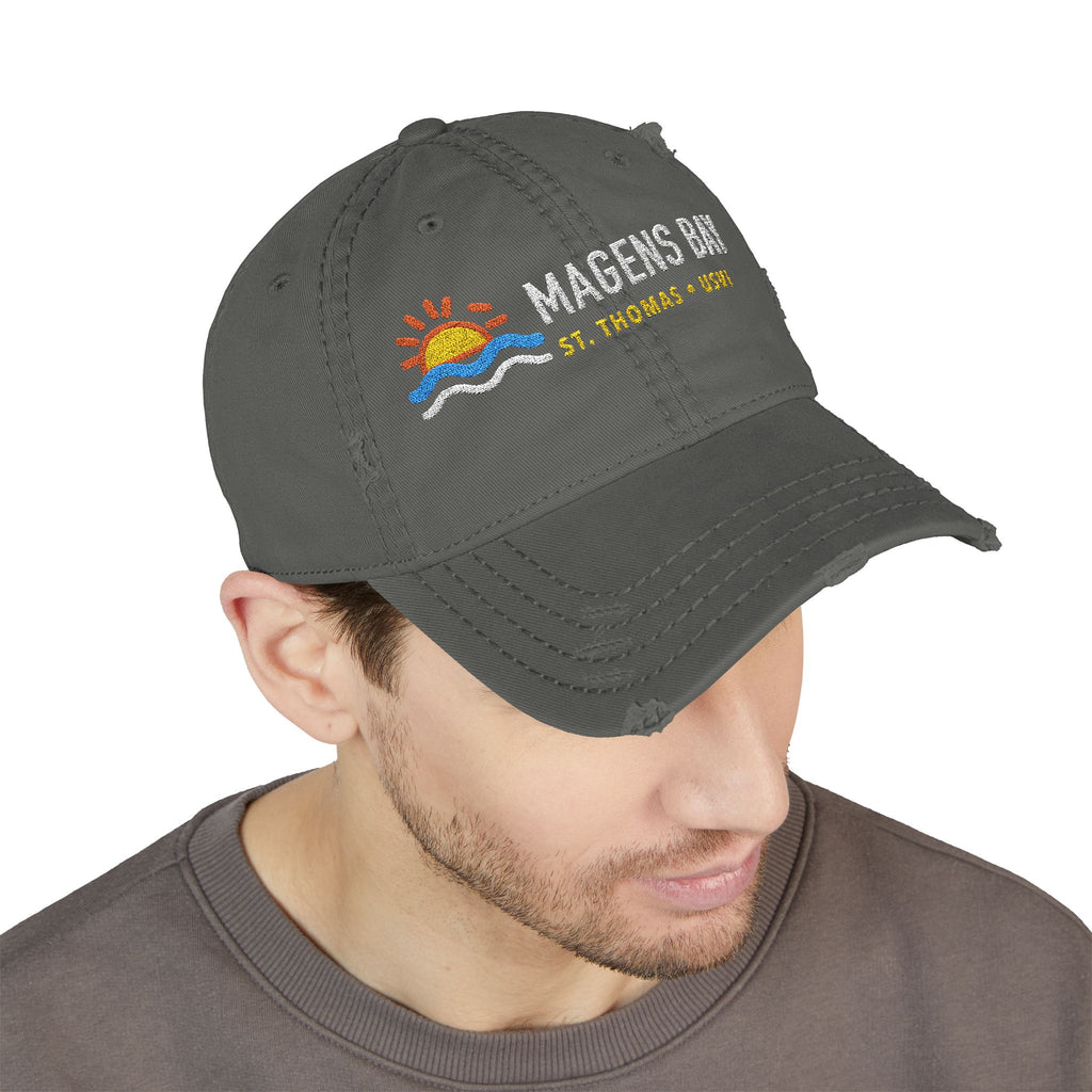 Distressed gray baseball cap with Magens Bay St. Thomas USVI embroidered text and sun graphic.