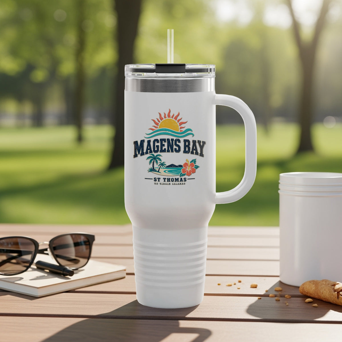 White tumbler with "Magens Bay St. Thomas US Virgin Islands" logo and straw.