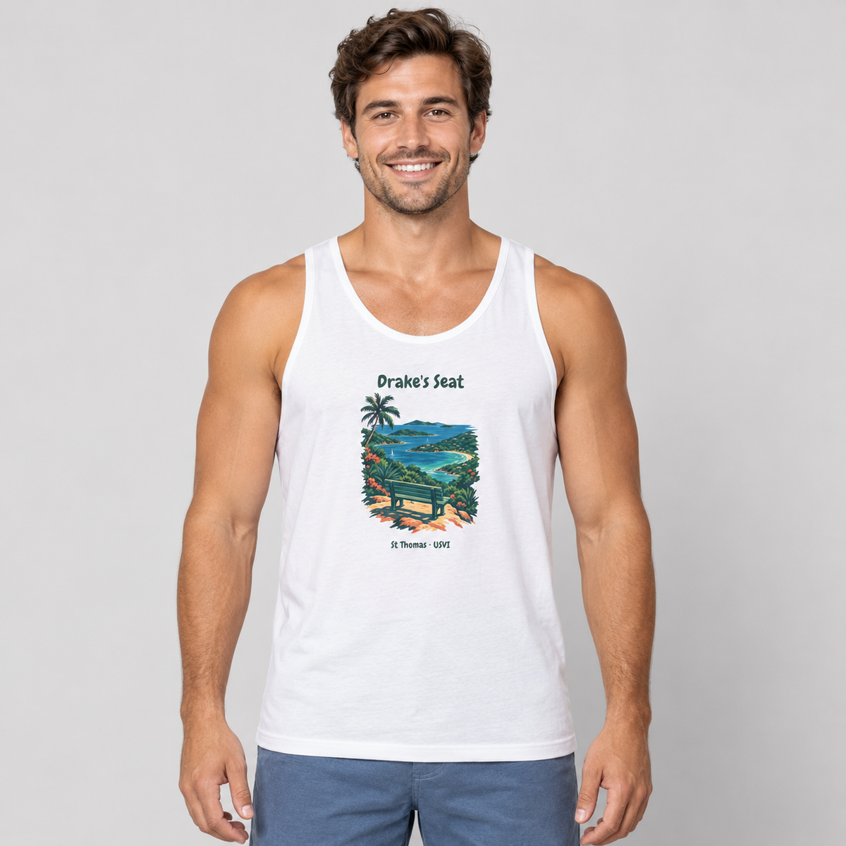 Male-model mockup of a white Bella+Canvas 3480 tank with Drake's Seat bay and bench artwork and St Thomas USVI lettering.