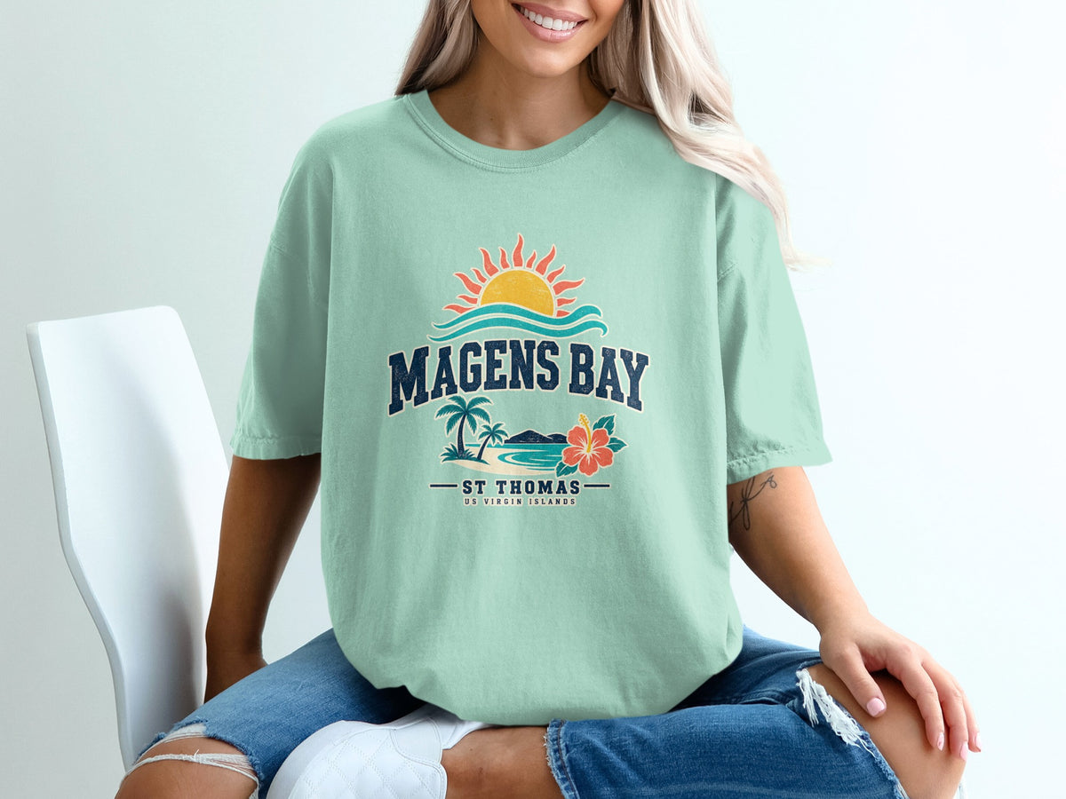 Magens Bay St Thomas US Virgin Islands graphic t-shirt with sun, waves, palms, and flower.