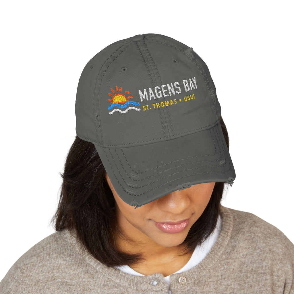 Distressed grey baseball cap with Magens Bay St. Thomas USVI embroidery and sun-wave graphic.
