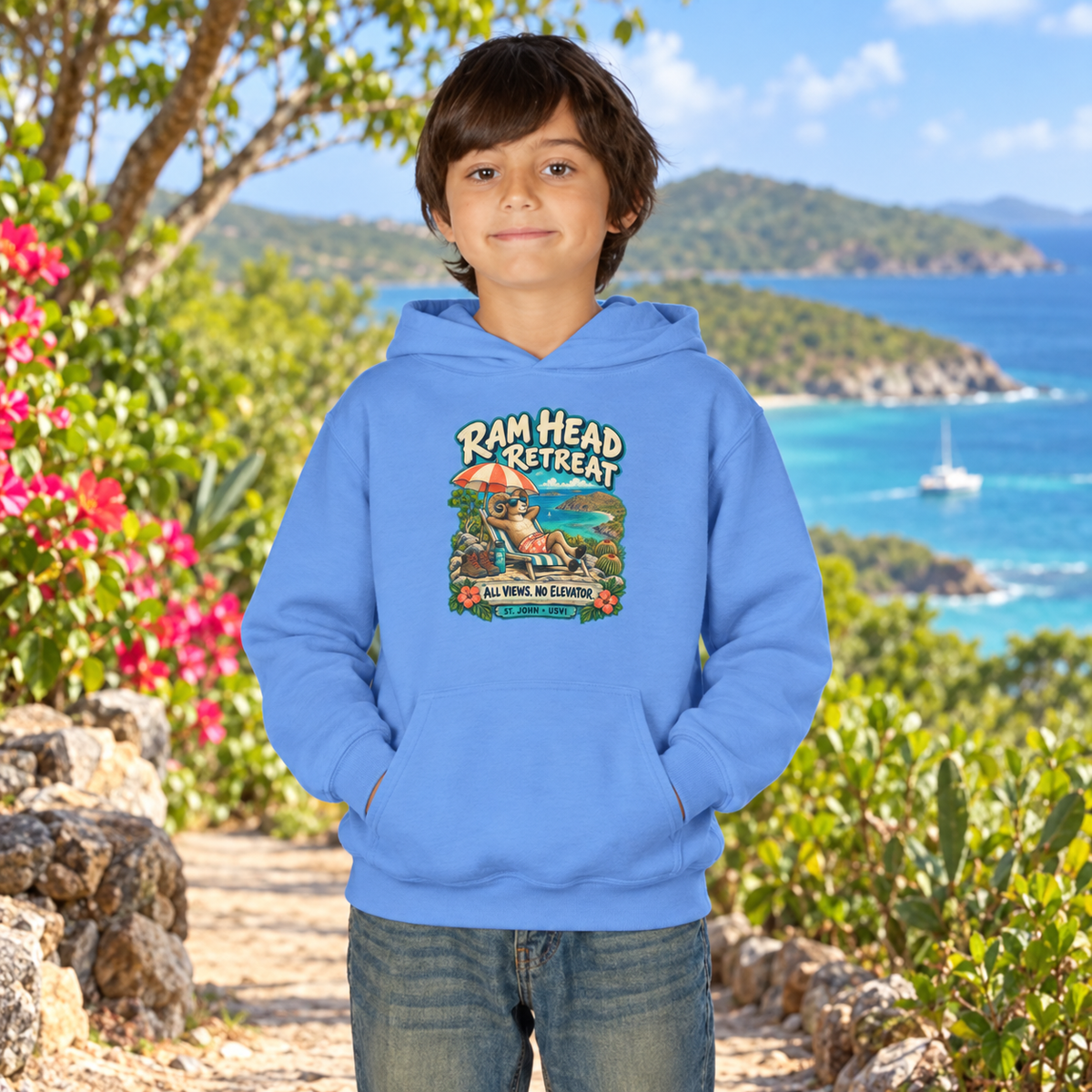AI-generated youth lifestyle mockup of a child wearing a Carolina Blue Gildan 18500B hoodie with Ram Head Retreat artwork in a tropical coastal setting.